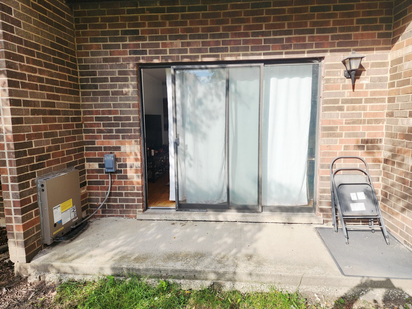 1026 Castilian Court, Unit 113 Glenview, IL 60025 - Photo 16 of 16 a view of a door and chair and table in the patio