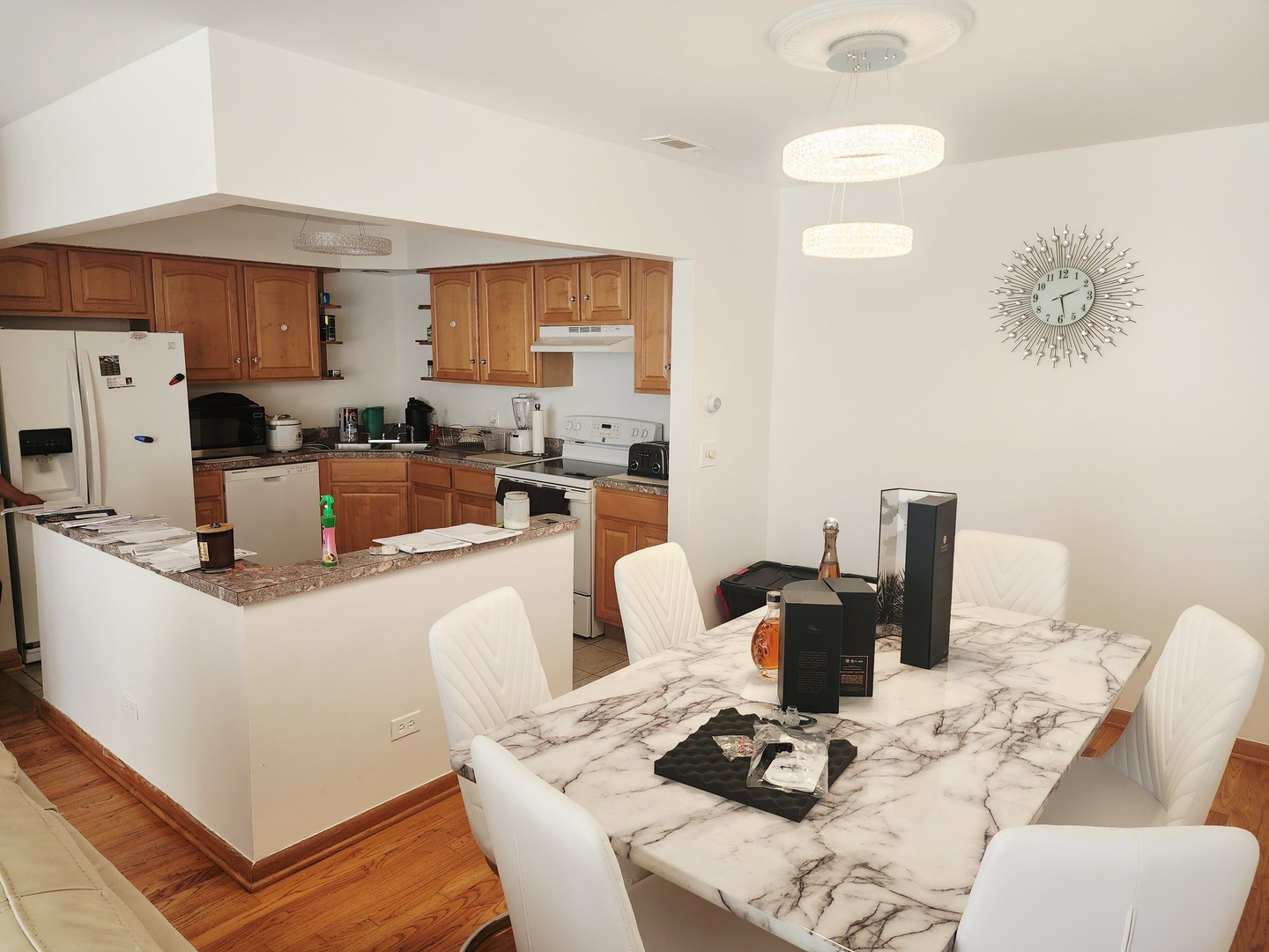 1026 Castilian Court, Unit 113 Glenview, IL 60025 - Photo 6 of 16 a view of a dining room with furniture and wooden floor