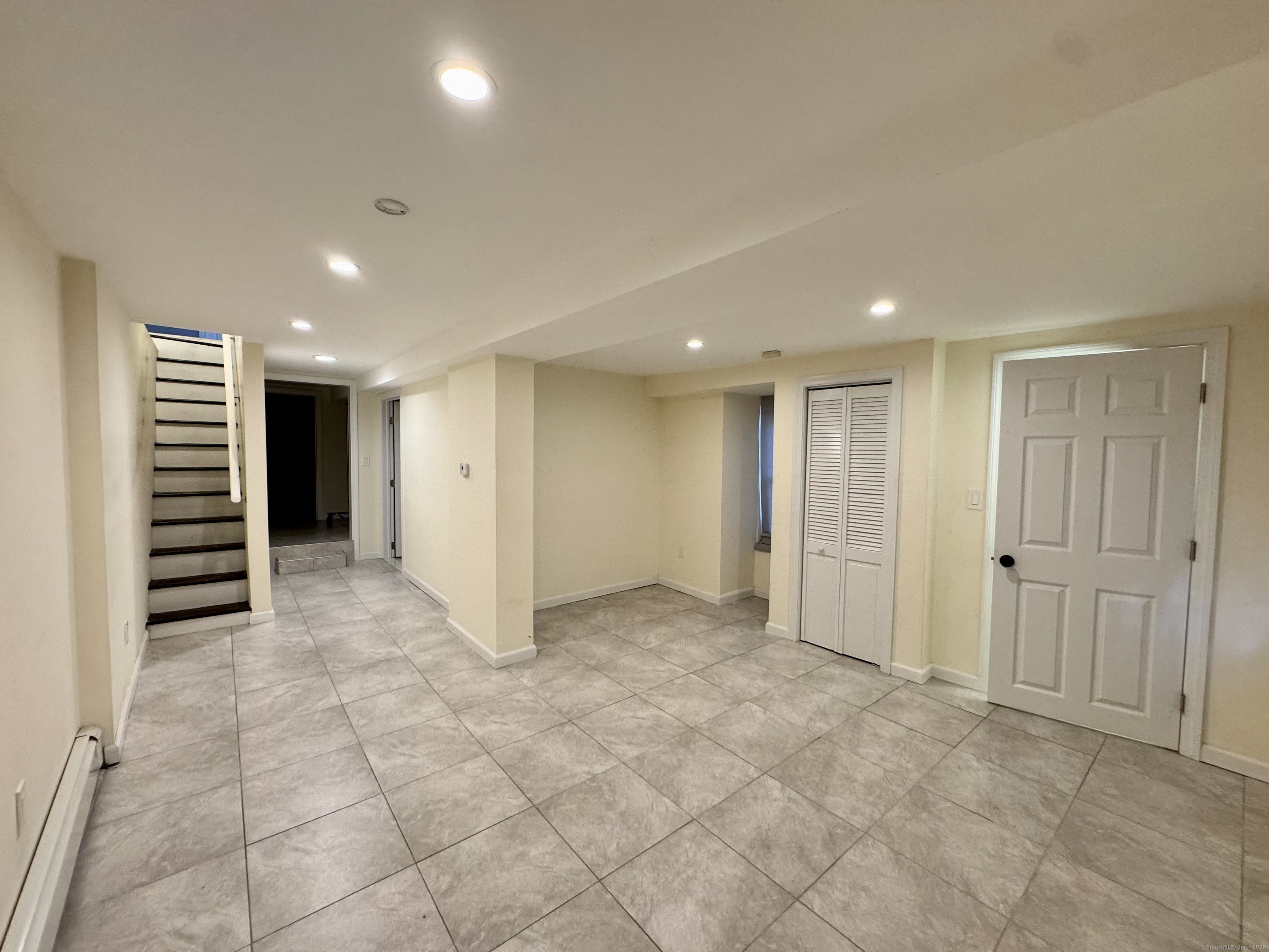 39 Bassett Street Ansonia, CT 06401 - Photo 13 of 21 a view of an empty room with a kitchen