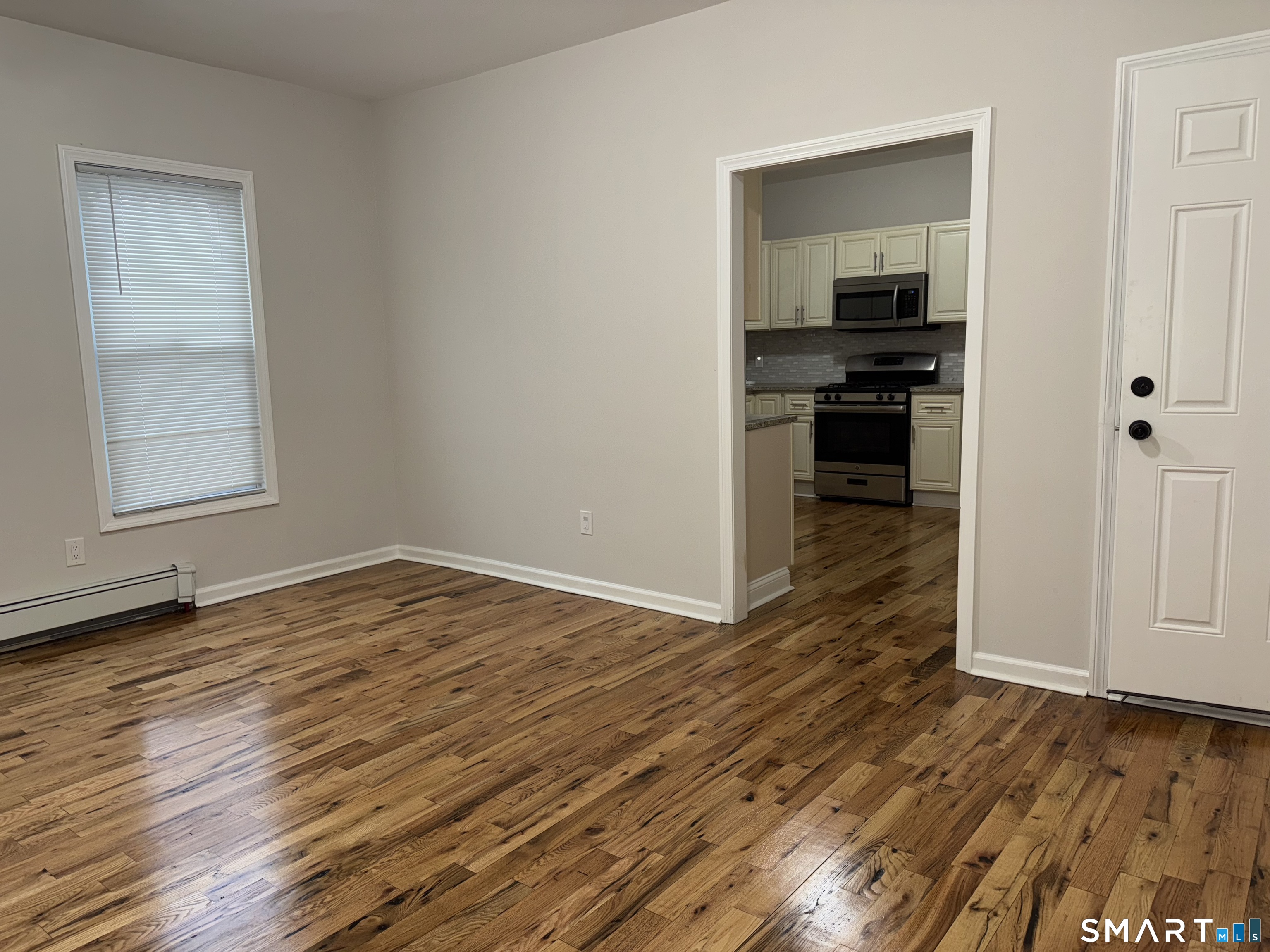 39 Bassett Street Ansonia, CT 06401 - Photo 2 of 21 wooden floor in an empty room