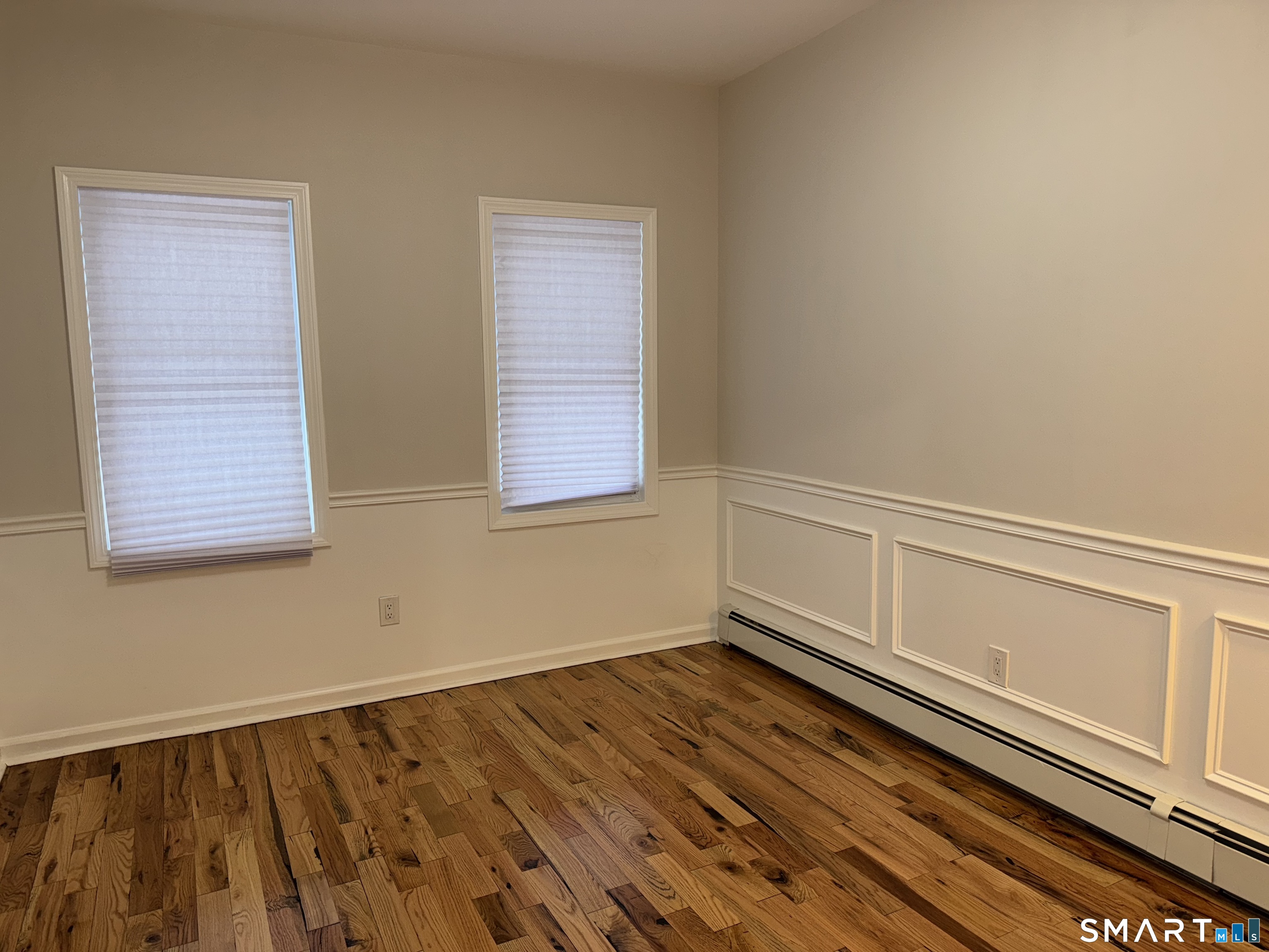 39 Bassett Street Ansonia, CT 06401 - Photo 6 of 21 a view of an empty room and window