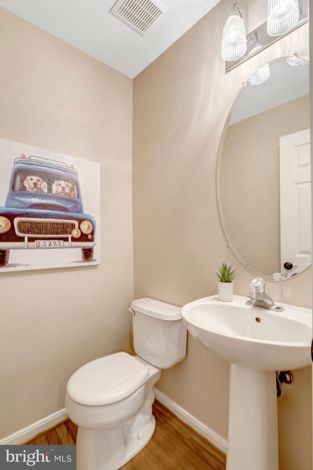 7706 Shadowcreek Terrace Springfield, VA 22153 - Photo 13 of 30 a bathroom with a sink a toilet and a mirror