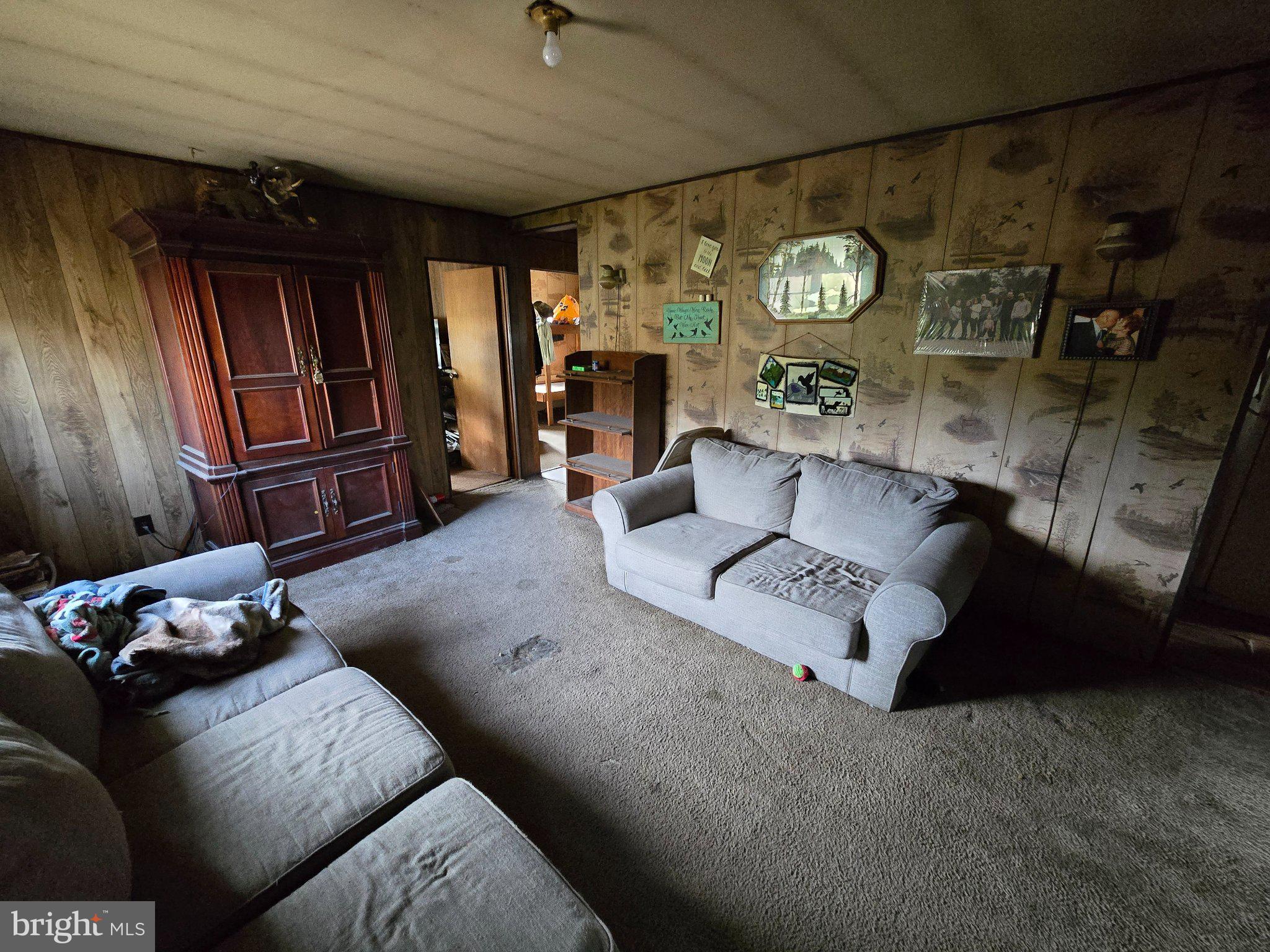 4081 Scootac Road Beech Creek, PA 16822 - Photo 17 of 46 a living room with furniture and wooden floor