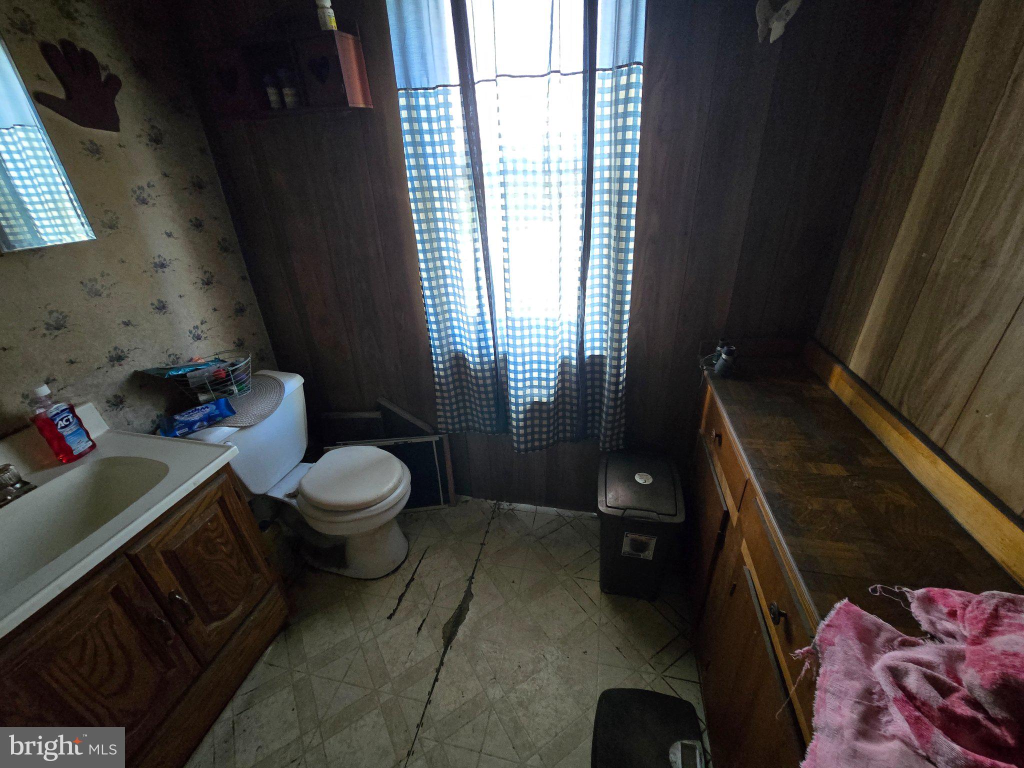 4081 Scootac Road Beech Creek, PA 16822 - Photo 19 of 46 a bathroom with a toilet sink and mirror