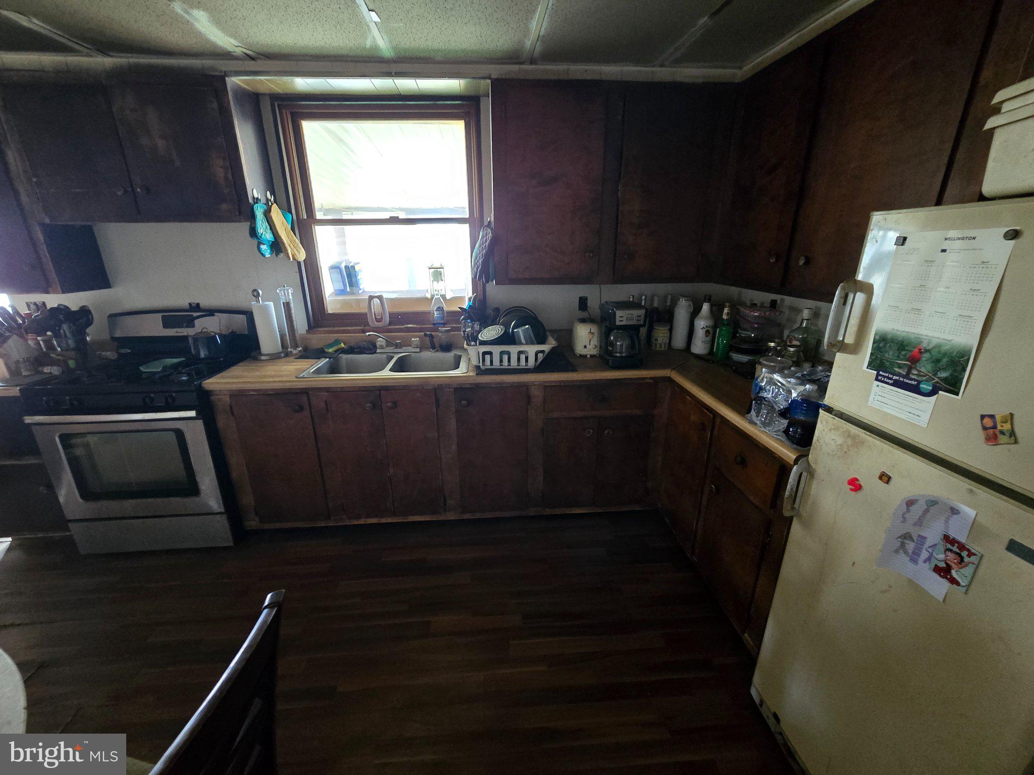 4081 Scootac Road Beech Creek, PA 16822 - Photo 29 of 46 a kitchen with granite countertop a stove and a refrigerator