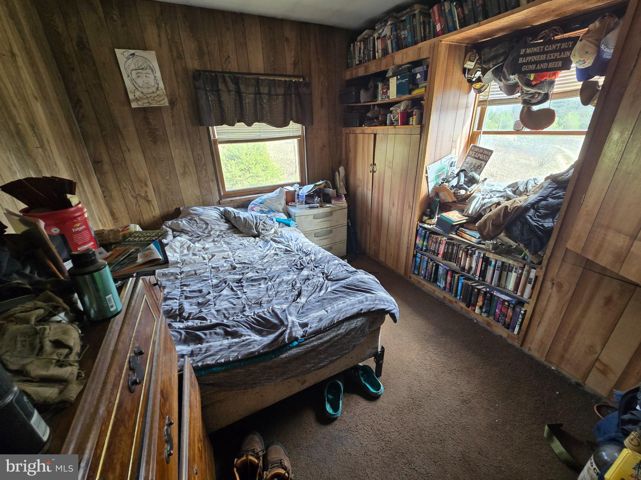 4081 Scootac Road Beech Creek, PA 16822 - Photo 30 of 46 a bed sitting in a bedroom next to a window