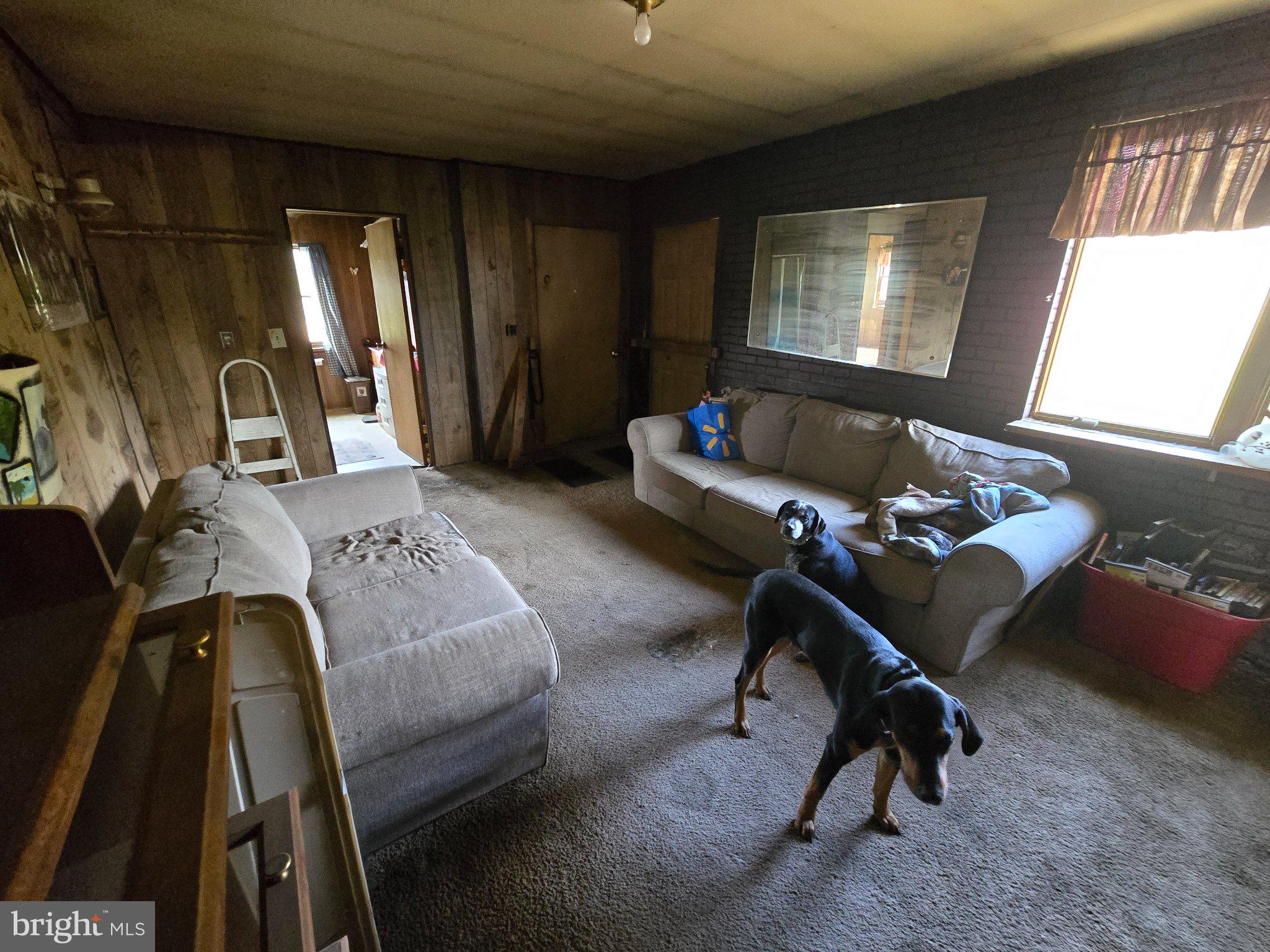 4081 Scootac Road Beech Creek, PA 16822 - Photo 33 of 46 a bedroom with a bed and a chandelier
