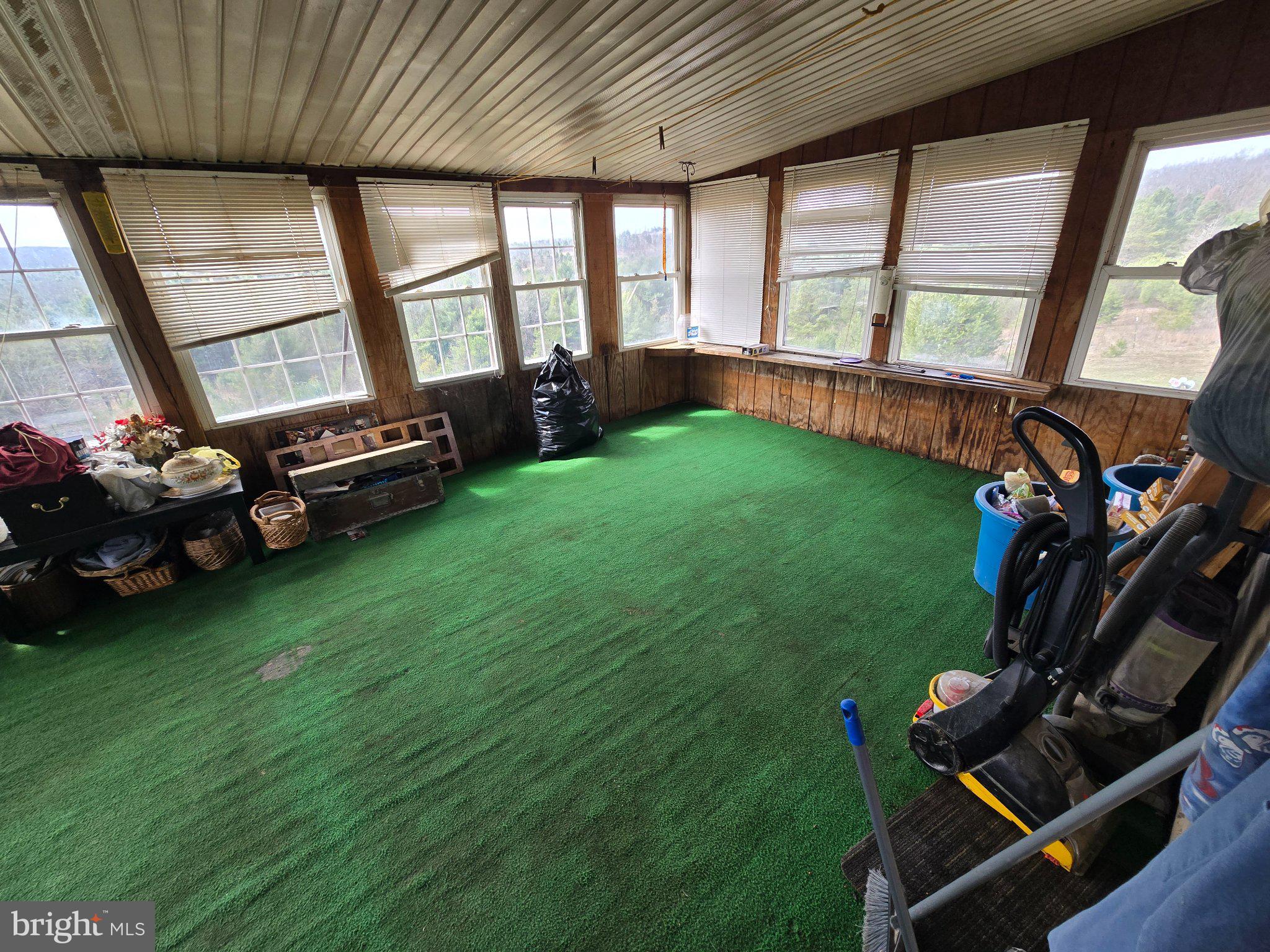 4081 Scootac Road Beech Creek, PA 16822 - Photo 35 of 46 a view of a room with gym equipment and a large window