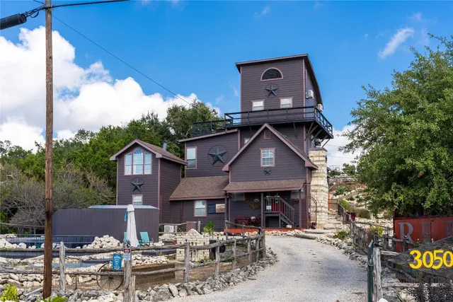 a front view of a house with sitting area