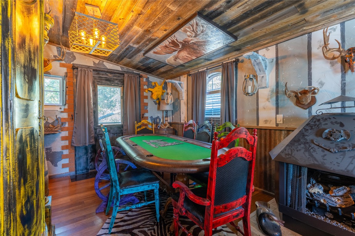 3050 Contour Drive Spring Branch, TX 78070 - Photo 13 of 39 a view of a dining room with furniture window and wooden floor