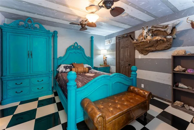 a bedroom with a bed and a baby crib