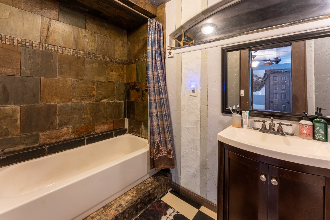 3050 Contour Drive Spring Branch, TX 78070 - Photo 19 of 39 a bathroom with a bathtub and a sink
