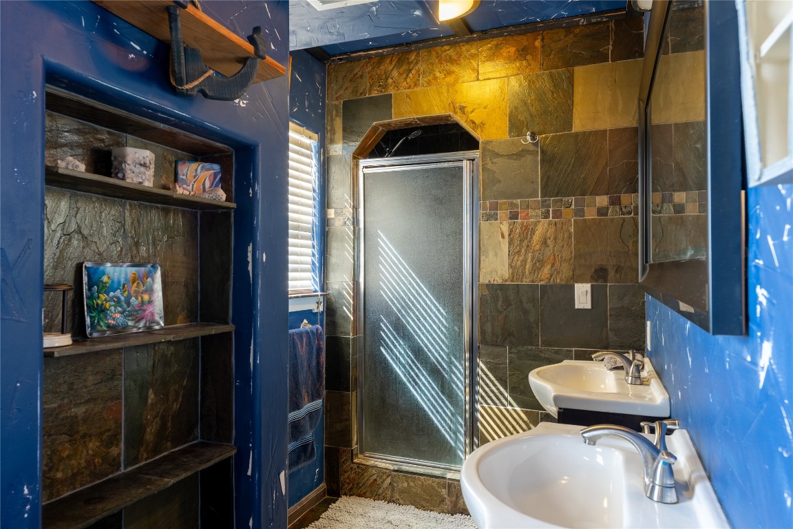3050 Contour Drive Spring Branch, TX 78070 - Photo 22 of 39 a bathroom with a sink a toilet and shower