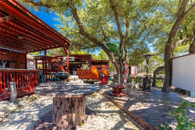 a view of outdoor space with table and chairs