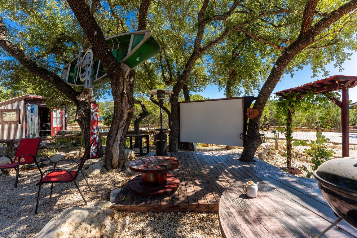 3050 Contour Drive Spring Branch, TX 78070 - Photo 30 of 39 a view of backyard with outdoor seating and trees