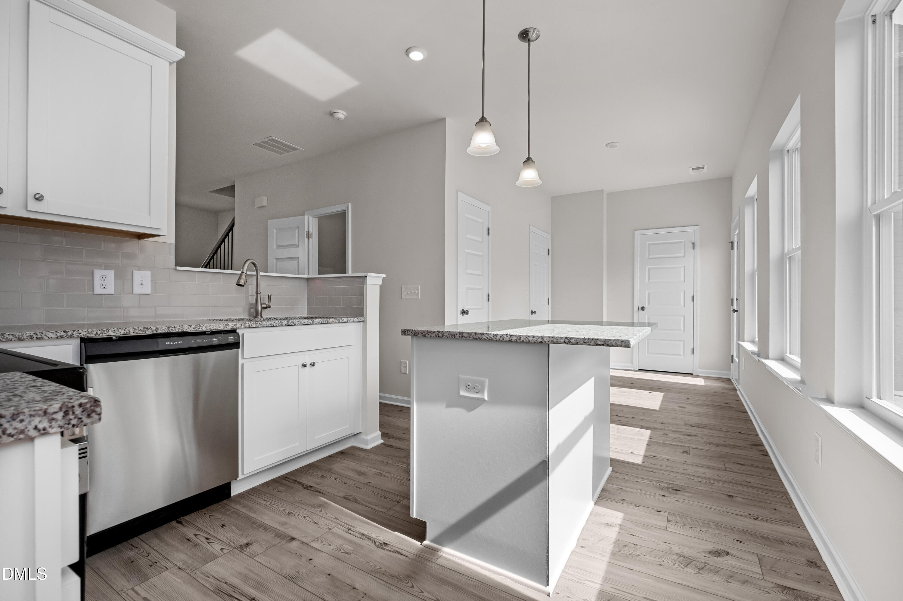 233 Courtside Drive Dunn, NC 28334 - Photo 14 of 29 a kitchen with white cabinets and sink