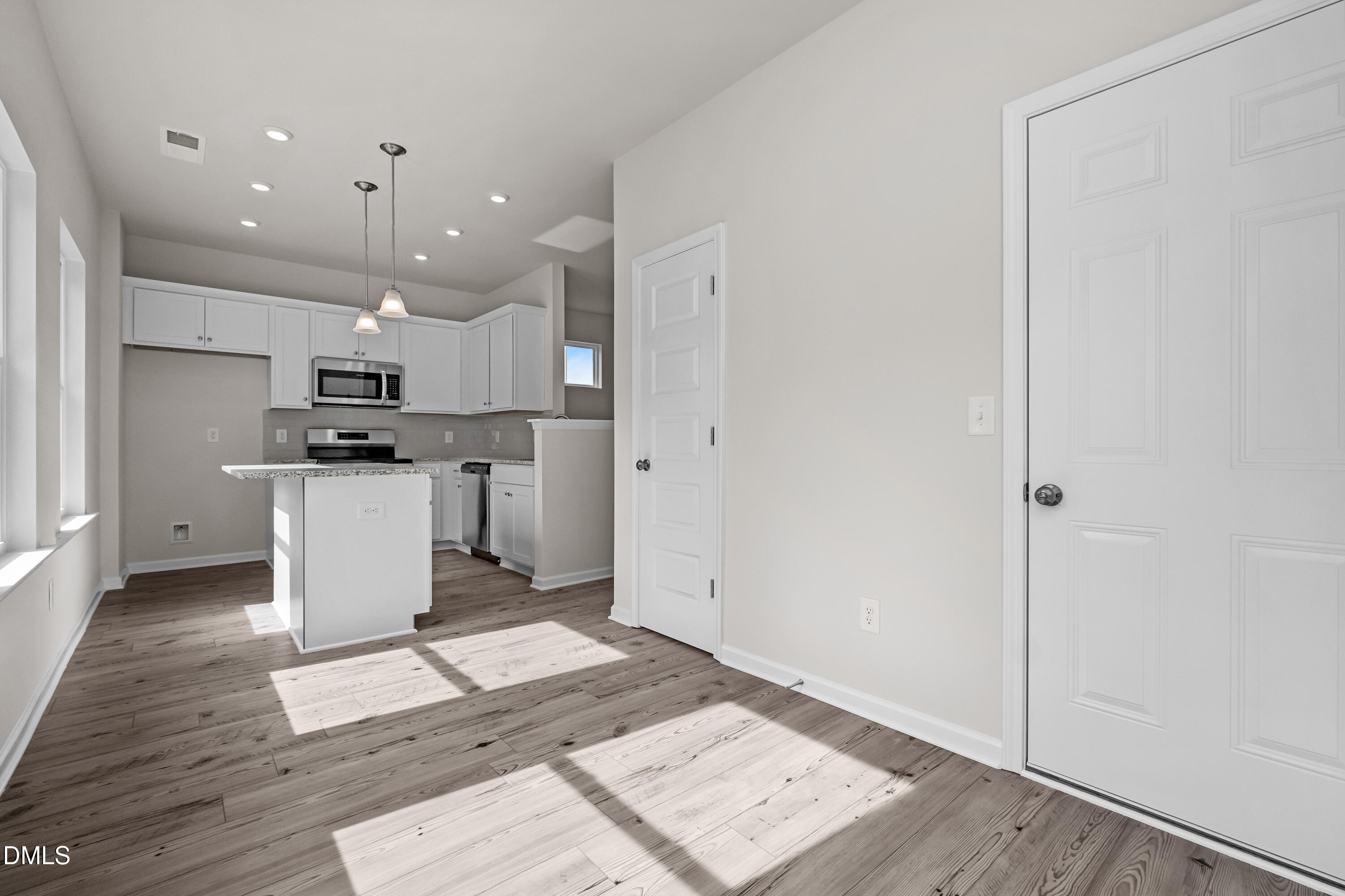 233 Courtside Drive Dunn, NC 28334 - Photo 15 of 29 a kitchen with a refrigerator and a stove top oven