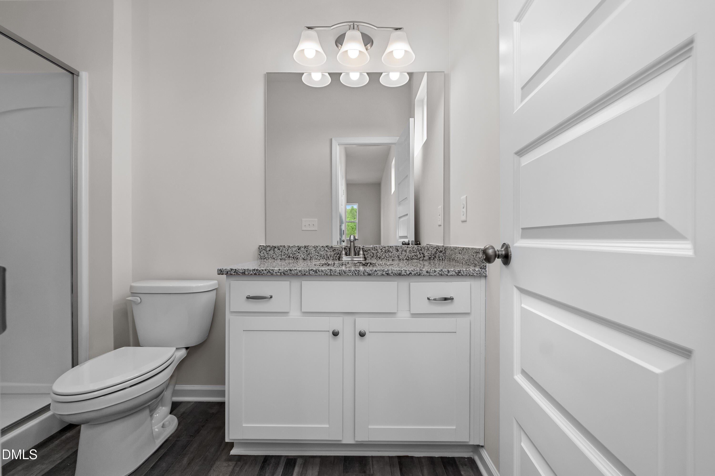 233 Courtside Drive Dunn, NC 28334 - Photo 20 of 29 a bathroom with a toilet sink and mirror