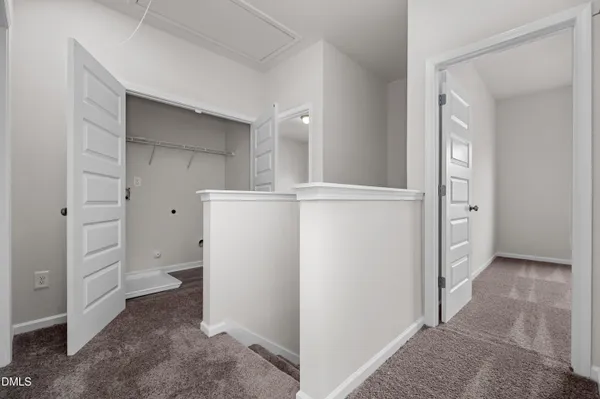 a view of a storage & utility room with cabinets