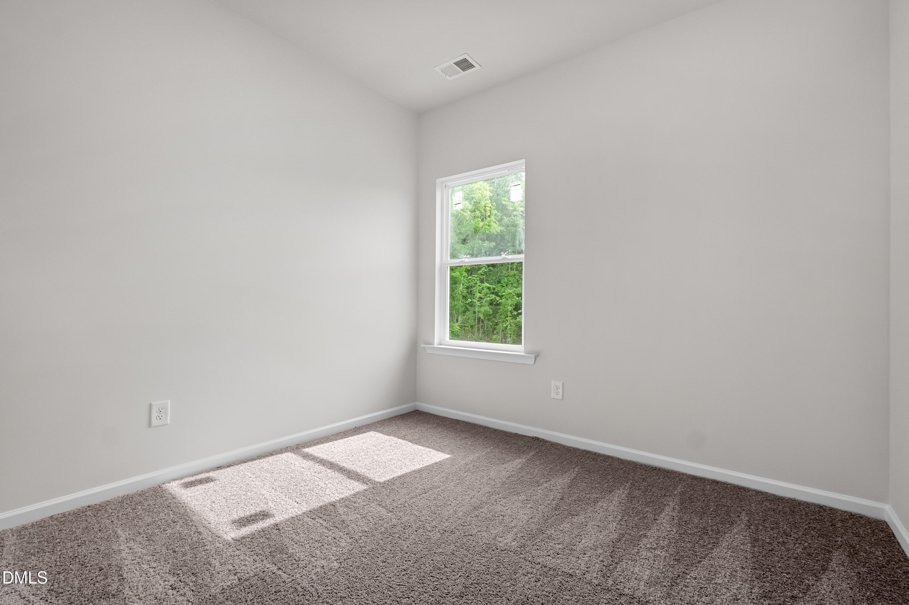 233 Courtside Drive Dunn, NC 28334 - Photo 24 of 29 an empty room with a window