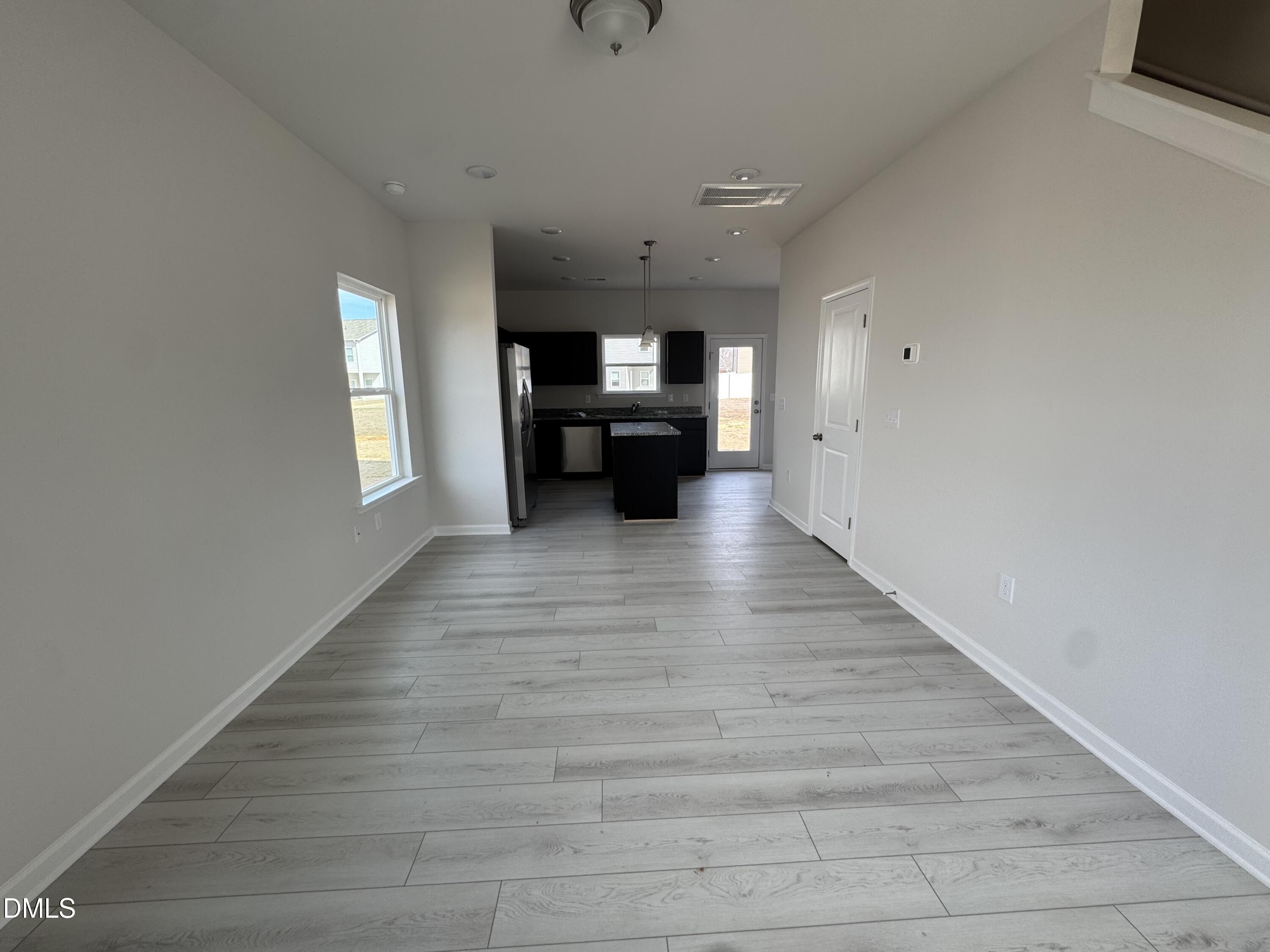 233 Courtside Drive Dunn, NC 28334 - Photo 6 of 29 a view of empty room with wooden floor