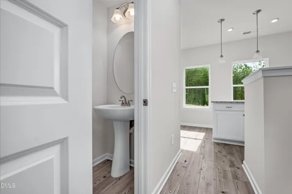 a bathroom with a sink and mirror