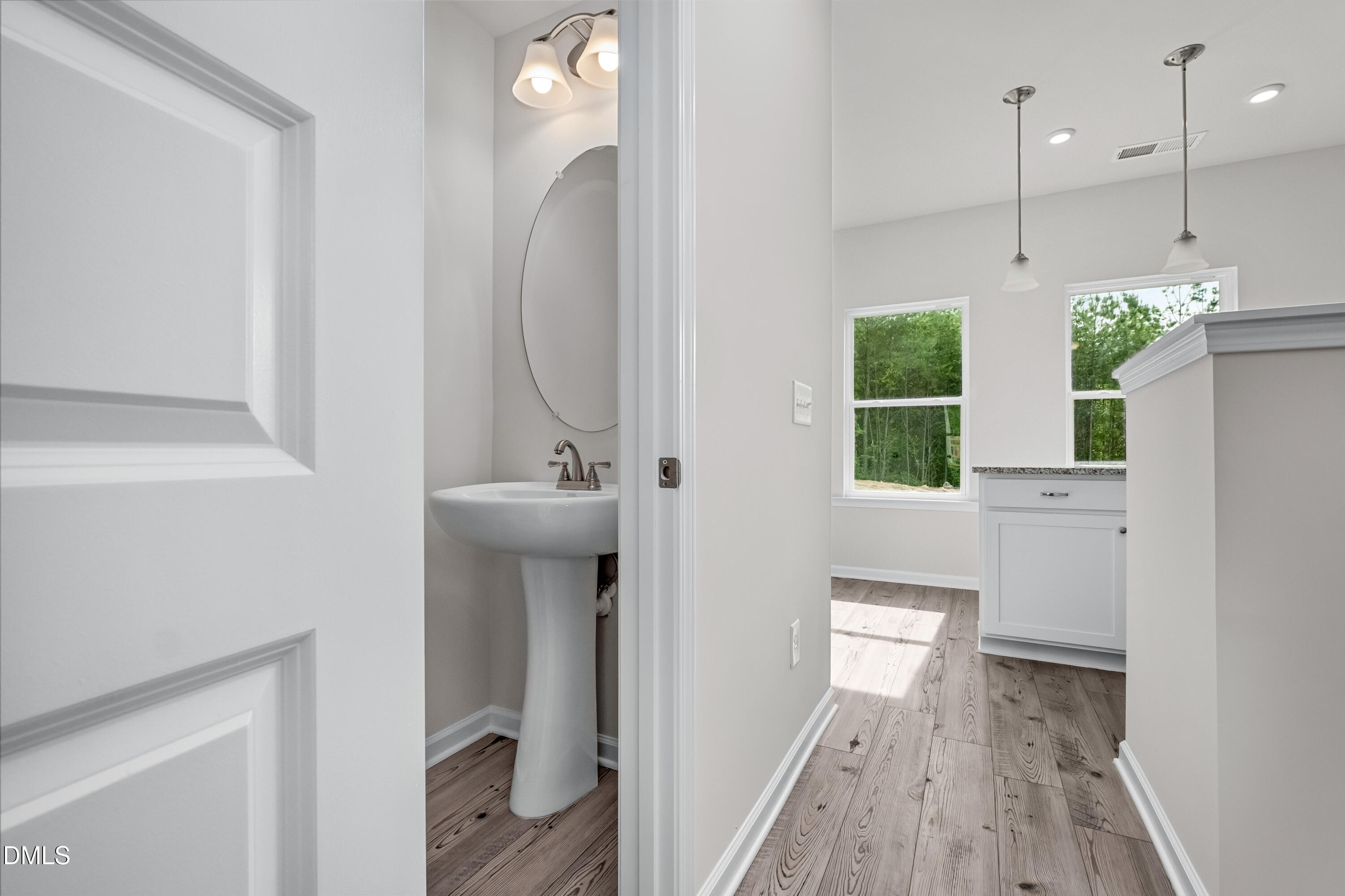 233 Courtside Drive Dunn, NC 28334 - Photo 8 of 29 a bathroom with a sink and mirror