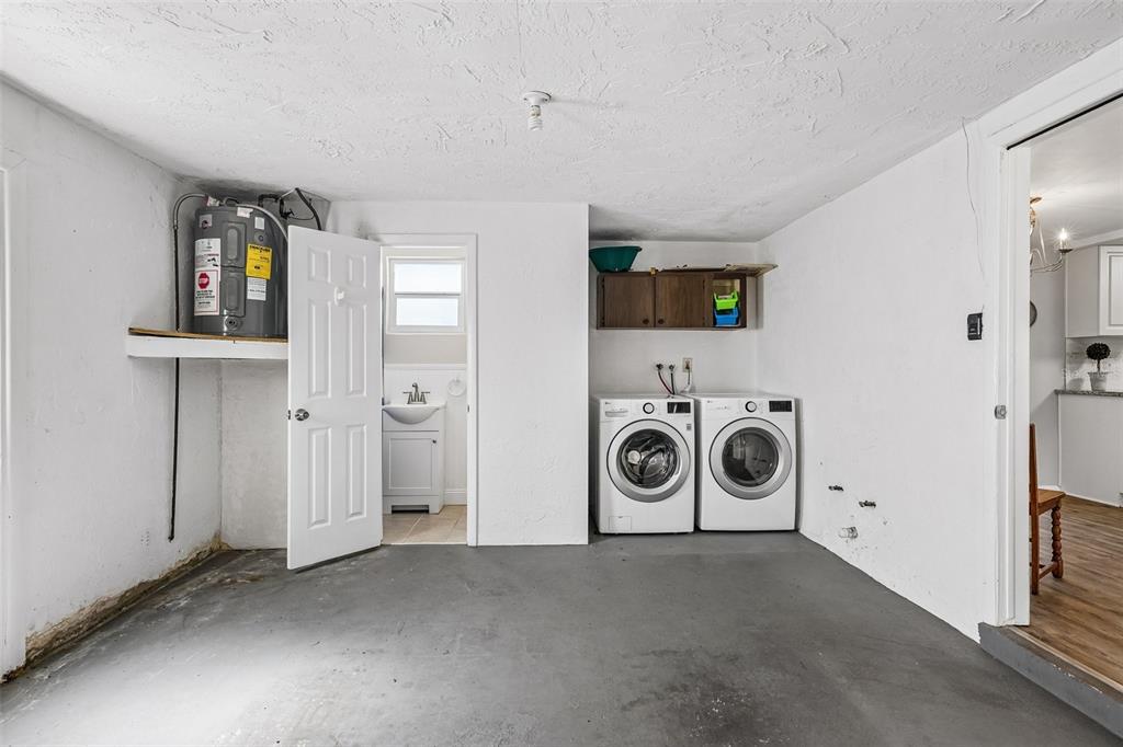 7215 Mayfield Drive Port Richey, FL 34668 - Photo 41 of 52 a view of a livingroom with washer and dryer