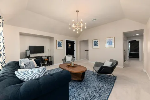 a living room with furniture or couch and a flat screen tv