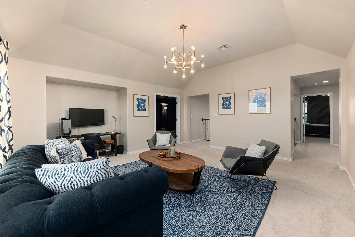8804 Flycatcher Court Austin, TX 78738 - Photo 17 of 39 a living room with furniture or couch and a flat screen tv
