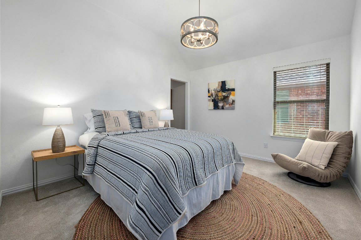 8804 Flycatcher Court Austin, TX 78738 - Photo 22 of 39 a bedroom with bed and window