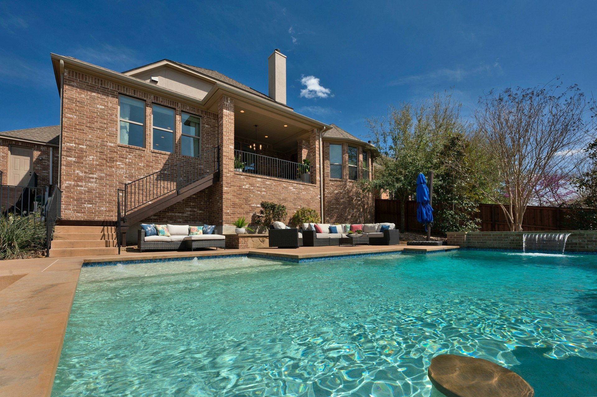 8804 Flycatcher Court Austin, TX 78738 - Photo 29 of 39 a front view of a house with a yard table and chairs