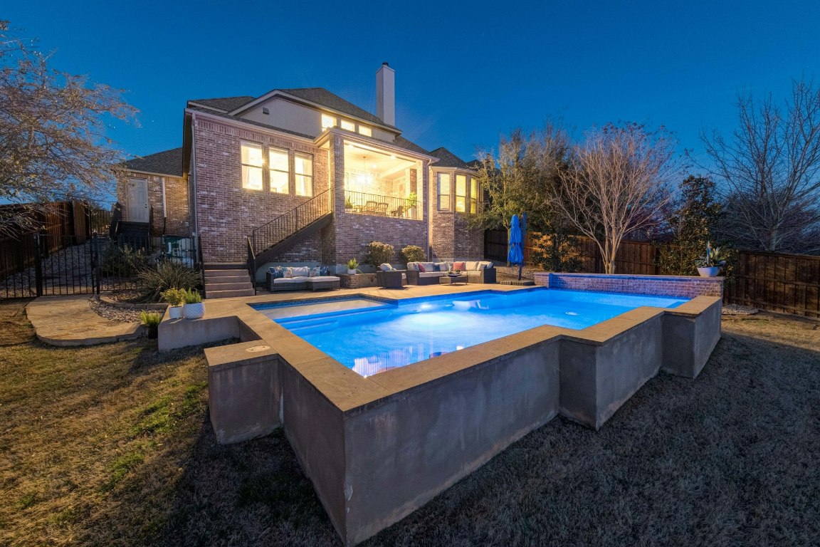 8804 Flycatcher Court Austin, TX 78738 - Photo 35 of 39 a view of swimming pool with outdoor seating and house in the background