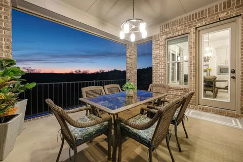 a view of a dining room with furniture wooden floor and chandelier