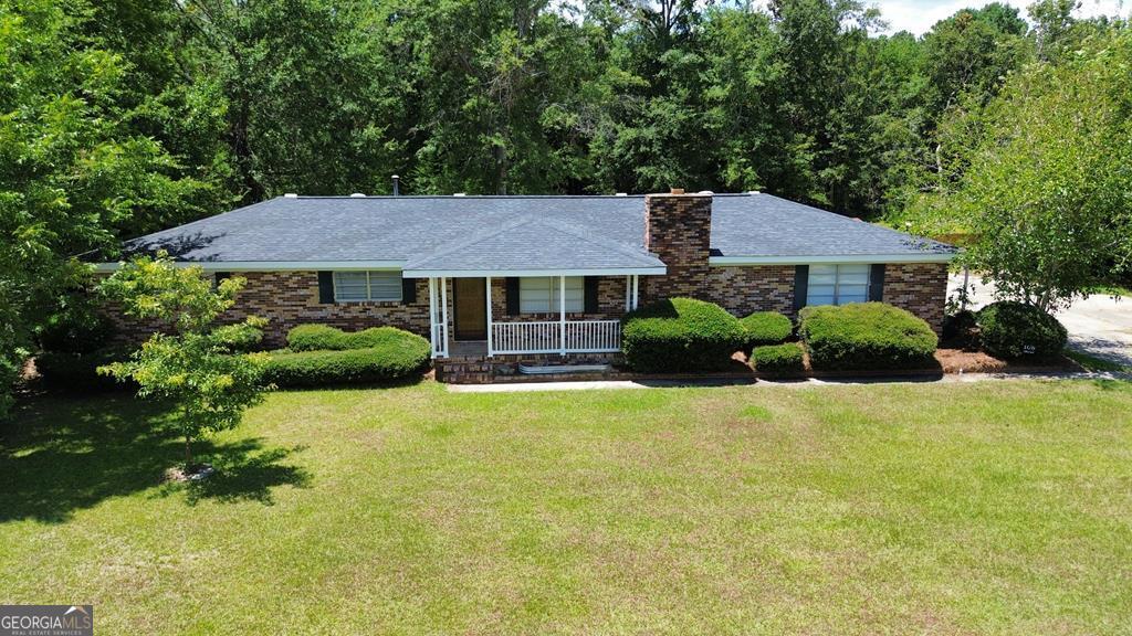 108 Plum Street Dublin, GA 31021 - Photo 9 of 33 a house that has a lot of plants in it