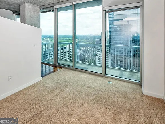 3324 Peachtree Road Northeast, Unit 2713 Atlanta, GA 30326 - Photo 11 of 29 a view of an empty room with windows
