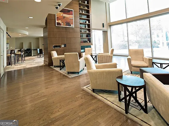 3324 Peachtree Road Northeast, Unit 2713 Atlanta, GA 30326 - Photo 15 of 29 a living room with furniture and a large window