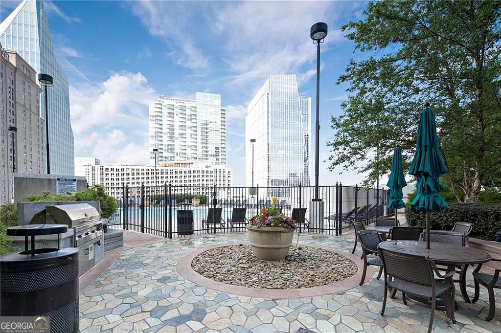 3324 Peachtree Road Northeast, Unit 2713 Atlanta, GA 30326 - Photo 18 of 29 a view of a patio with couches table and chairs