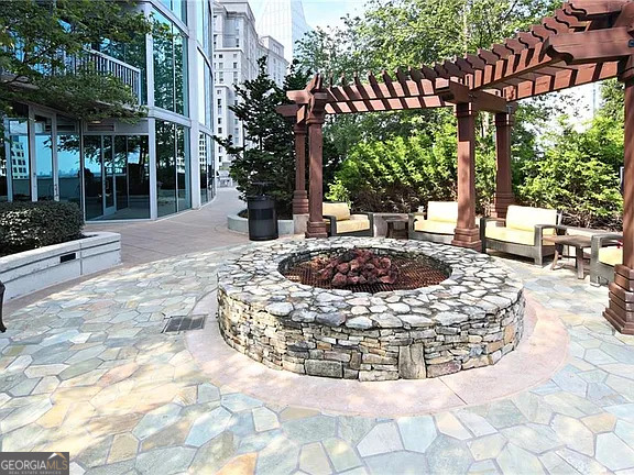 3324 Peachtree Road Northeast, Unit 2713 Atlanta, GA 30326 - Photo 22 of 29 a view of a house with backyard and sitting area