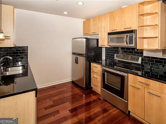 3324 Peachtree Road Northeast, Unit 2713 Atlanta, GA 30326 - Photo 4 of 29 a kitchen with appliances a counter space and a window