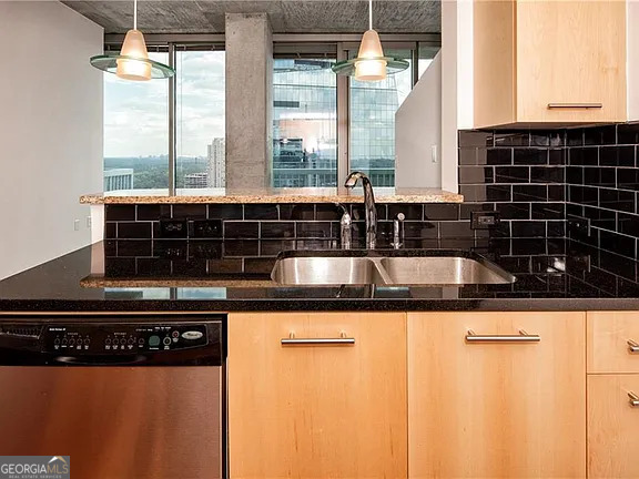 3324 Peachtree Road Northeast, Unit 2713 Atlanta, GA 30326 - Photo 6 of 29 a kitchen with a sink a counter top space and cabinets