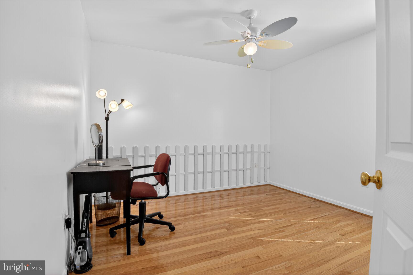 14272 Town Commons Way Gainesville, VA 20155 - Photo 22 of 32 a workspace with furniture and wooden floor