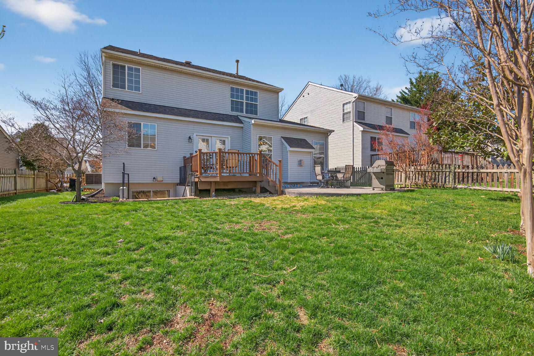 14272 Town Commons Way Gainesville, VA 20155 - Photo 3 of 32 a front view of house with yard