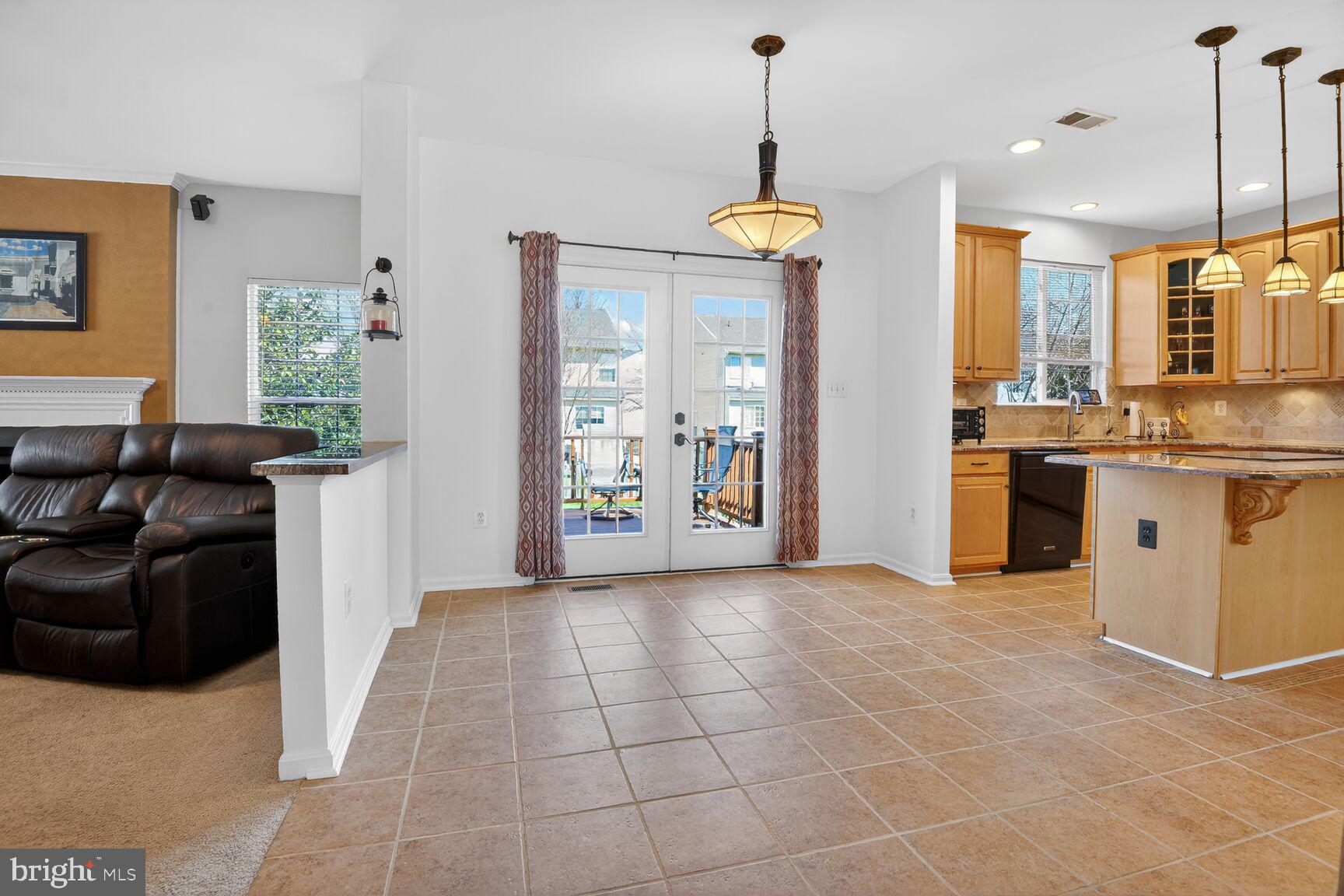 14272 Town Commons Way Gainesville, VA 20155 - Photo 9 of 32 a view of a kitchen with furniture and a window