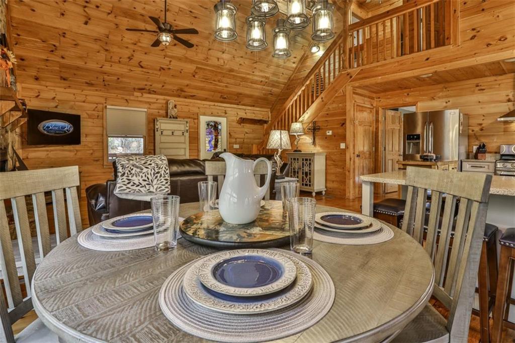 178 Novena Court Ellijay, GA 30540 - Photo 13 of 88 a view of a dining room with furniture and wooden floor
