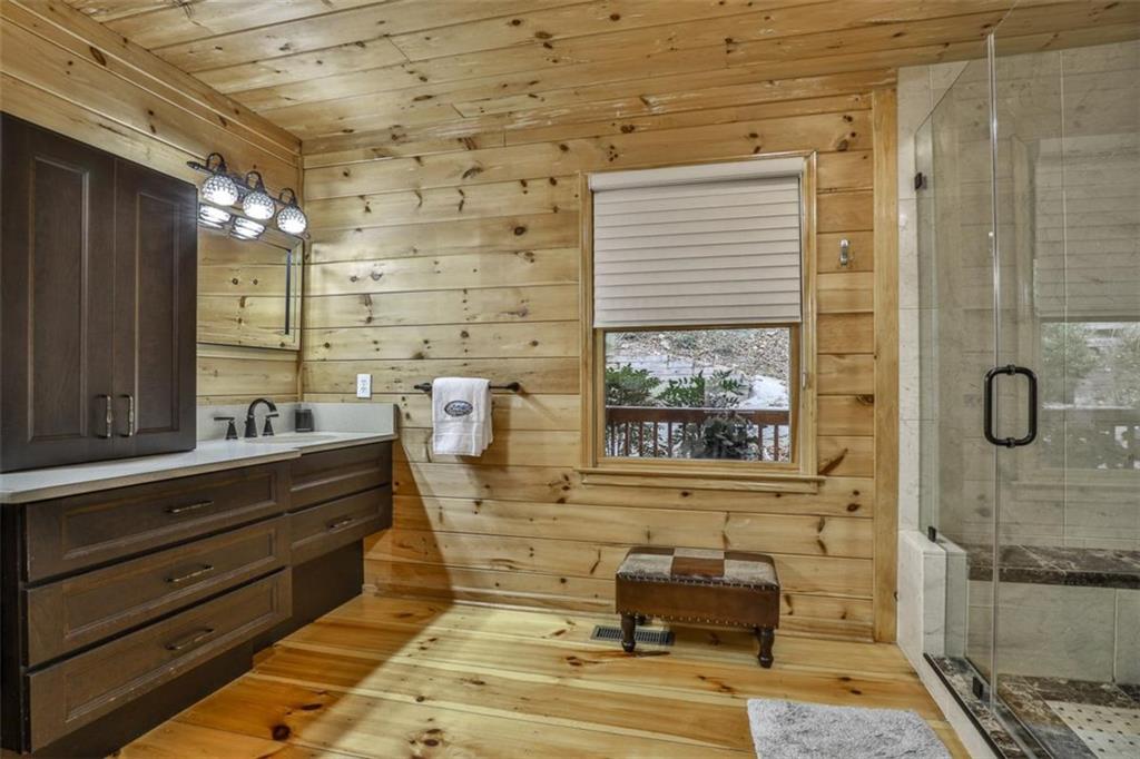 178 Novena Court Ellijay, GA 30540 - Photo 27 of 88 a bathroom with a tub sink and mirror