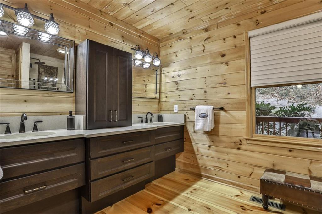 178 Novena Court Ellijay, GA 30540 - Photo 29 of 88 a bathroom with a mirror and a sink