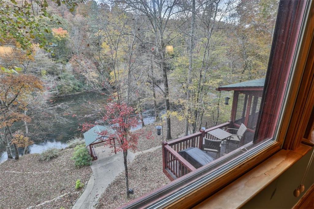 178 Novena Court Ellijay, GA 30540 - Photo 32 of 88 a view of a balcony with chair and wooden floor