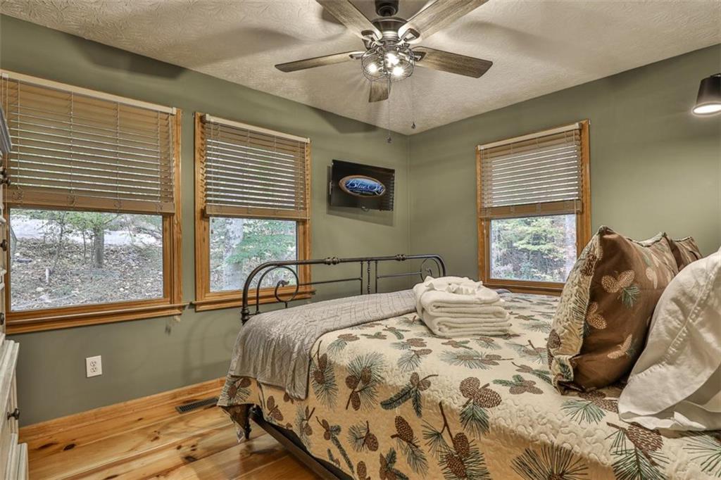 178 Novena Court Ellijay, GA 30540 - Photo 35 of 88 a bedroom with a bed and a window