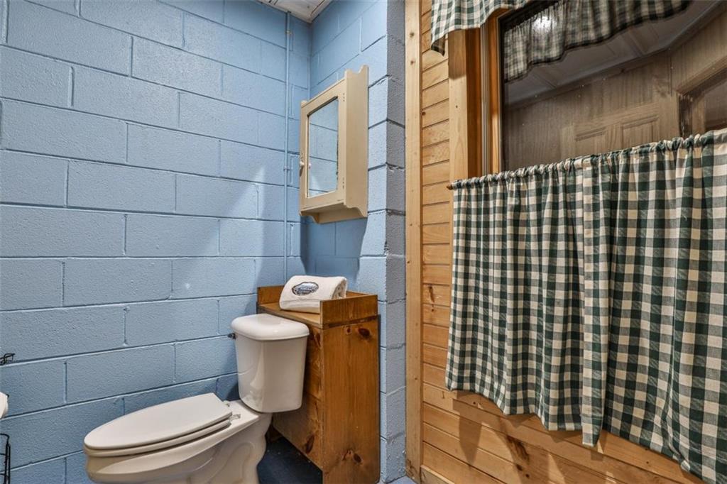 178 Novena Court Ellijay, GA 30540 - Photo 37 of 88 a white toilet sitting next to a bathroom